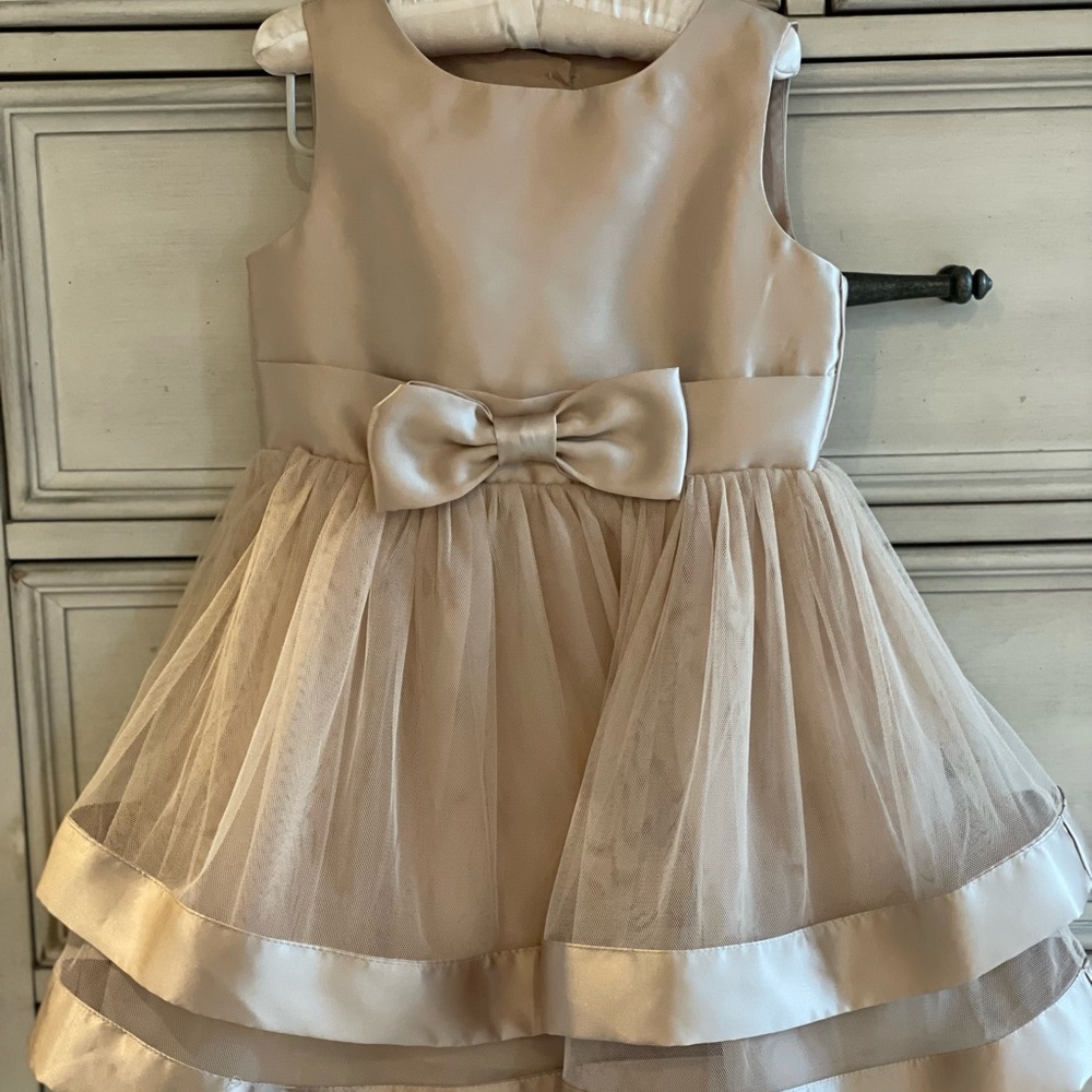 Formal Champaign colored dress size 4. Worn only once is in excellent condition.